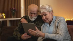 Elderly couple talking to doctor on tablet during online medical consultation - Powered by Shutterstock - Get 15% off with code: PIKWIZARD15