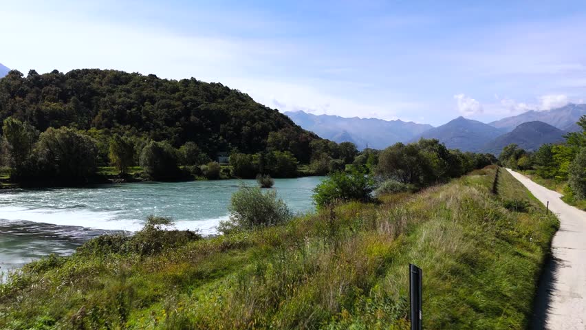 Fly out over Adda river in Lombardy region, Italy