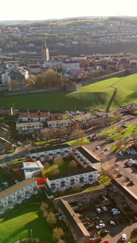 Wide social media ratio aerial GV video of the Derry City Walls in Derry, County Londdonderry in Northern Ireland. Filmed in 1080x1920, 60FPS and with Rec709 color.