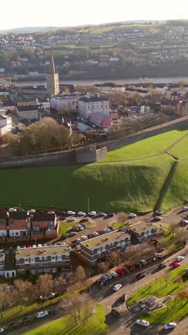 Ultra-wide social media ratio aerial GV video of the Derry City Walls in Derry, County Londdonderry in Northern Ireland. Filmed in 1080x1920, 60FPS and with Rec709 color.