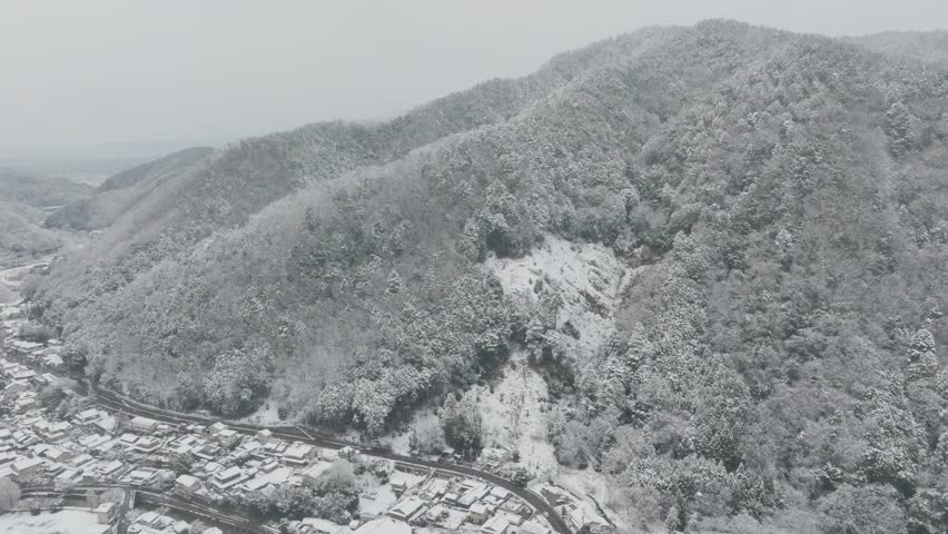 Aerial view Over Snowy Valley Houses of Yase Kyoto Japan in Winter, Mount Hiel