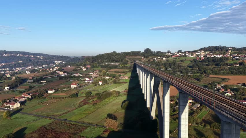 4K drone aerial view. Railway viaduct in the Eixo district, south of Santiago de Compostela. 96 meters high.