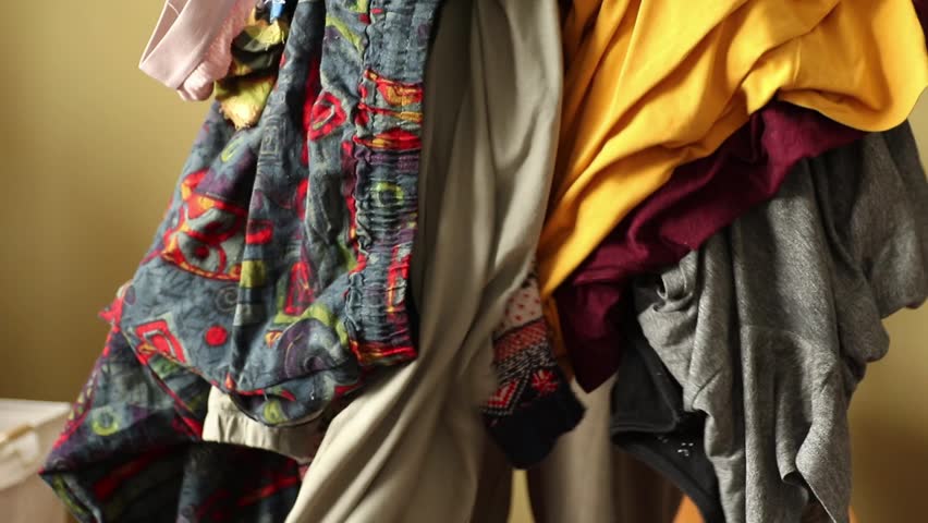 Angry Woman Throws Dirty Clothes. Cleaning Outburst. Disappointed Woman Throws Dirty Laundry. Cleaning Frustration.