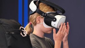 Girl experiencing virtual reality wearing modern VR headset - Powered by Shutterstock - Get 15% off with code: PIKWIZARD15