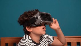 Little boy Immersed in cyberspace, metaverse, learning in virtual reality. Kid playing games. Child learning using virtual reality headset. Education child in virtual reality glasses. laptop and globe - Powered by Shutterstock - Get 15% off with code: PIKWIZARD15