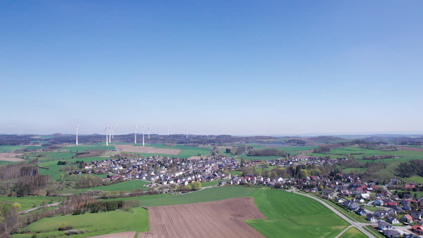 Explore a beautiful aerial view of a peaceful rural landscape in springtime