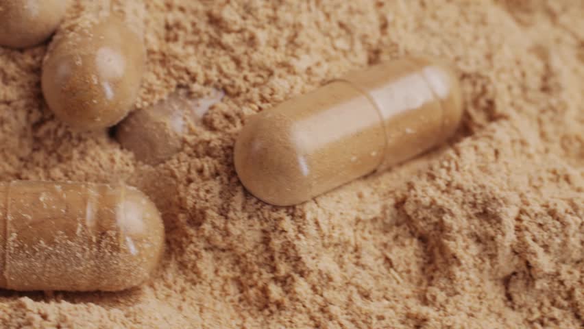 Ashwagandha Indian Ginseng Powder in White Bowl isolated on white background, superfood close up. 