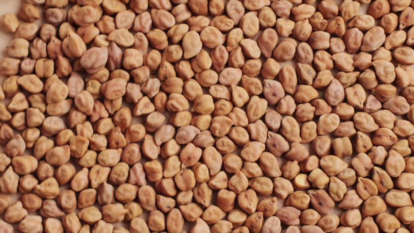 Chickpeas macro close up, background of uncooked dried chickpeas