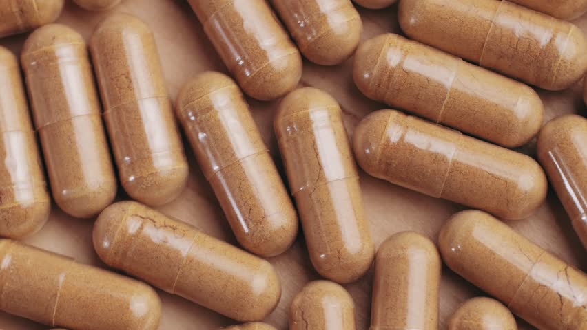 Ashwagandha Indian Ginseng Powder in White Bowl isolated on white background, superfood close up. 