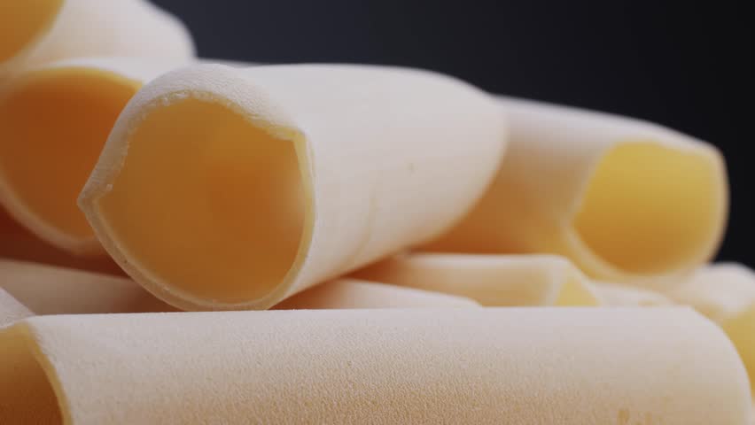 Raw Italian spanish Cannelloni Pasta in supermarket texture close up. Cooking background. Italian food concept.