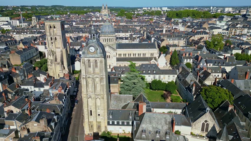 Basilica of Saint-Martin and clock tower in Tours, France. Aerial drone orbiting and cityscape