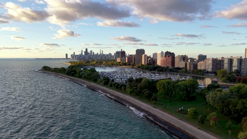 aerial push in to the chicago illinois skyline over a marina along the lakefront