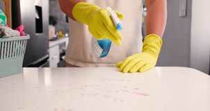 Hands, man and clean with spray on kitchen counter, hygiene and home maintenance to prevent germ spread. Disinfectant tools, surface cleaner and housekeeper with sanitize tabletop, tidy and wipe dirt - Powered by Shutterstock - Get 15% off with code: PIKWIZARD15
