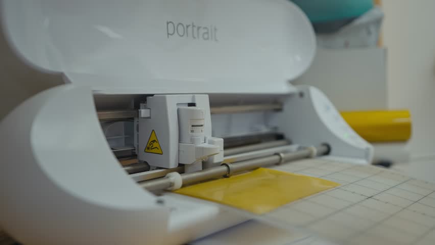 Vinyl Cutting Machine Working on Yellow Sheet