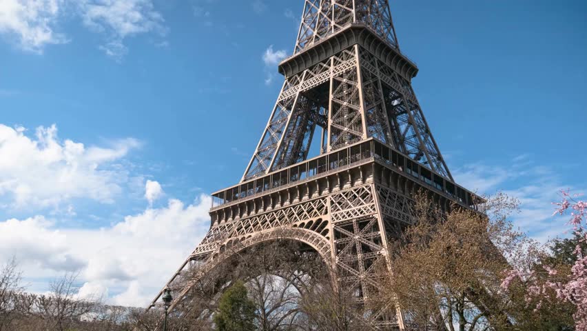 Eiffel Tower close up view from road during daytime. Close-up view of the Tower