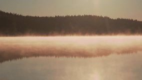 Morning mist rolls over a serene lake near Gothenburg Sweden creating a peaceful landscape - Powered by Shutterstock - Get 15% off with code: PIKWIZARD15