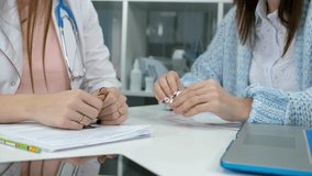 A doctor writes a prescription Male medicine medical practitioner hand hold document patient journal medical and medication at hospital. movie slow - Powered by Shutterstock - Get 15% off with code: PIKWIZARD15