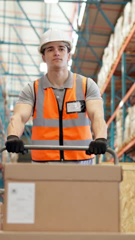 Man, trolley and walking with box at warehouse to transport stock, export cargo and supply chain. Person, cart and delivery of shipping, storage management and inventory for industrial distribution