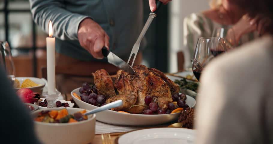 Thanksgiving, hands and cut turkey with family for dinner, feast or party at dining table in home. Knife, meat or carving food for holiday celebration, roast meal and people at social gathering event