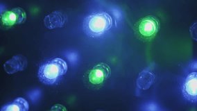 Macro of flashing RGB LED lights on a panel showing pulsing blue red and green diodes with sparkly dust particles creating a dynamic colorful and abstract electronic light show. - Powered by Shutterstock - Get 15% off with code: PIKWIZARD15