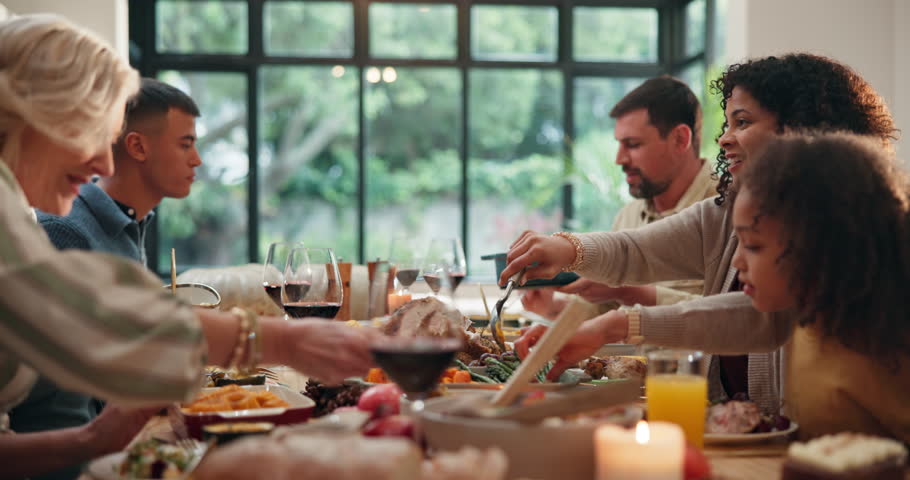 Serving, food or people at family dinner in home to celebrate thanksgiving, relax or chat together. Support, talking or happy group in dining room for holiday reunion, share or pass feast for bonding