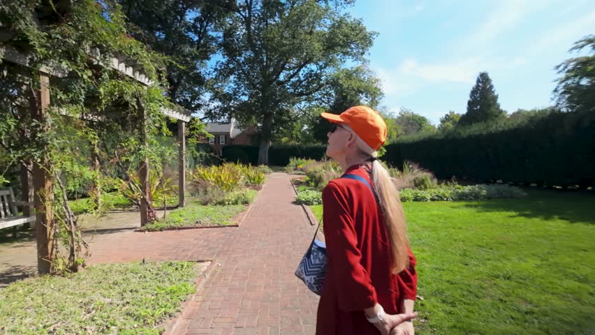 Visit the beautiful gardens at the Museum of the Shenandoah in Winchester, Virginia. Enjoy walking through lush greenery and scenic pathways on a cloudy day.