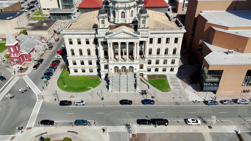 A building that houses the trials of the accused impartially and separating the fact from fiction to substantiate the credibility of a position and arrive at the truth. Syracuse, NY, USA - April 23, 2