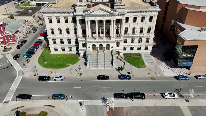 A building that houses the trials of the accused impartially and separating the fact from fiction to substantiate the credibility of a position and arrive at the truth. Syracuse, NY, USA - April 23, 2