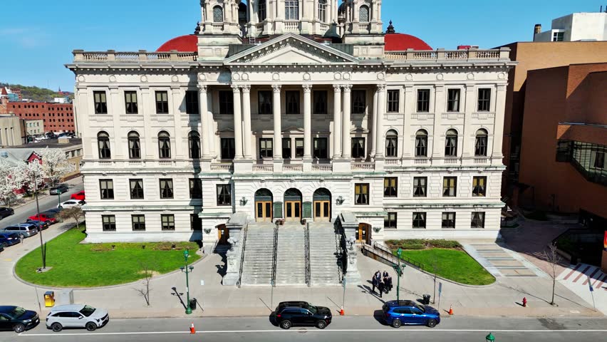 A building that houses the trials of the accused impartially and separating the fact from fiction to substantiate the credibility of a position and arrive at the truth. Syracuse, NY, USA - April 23, 2