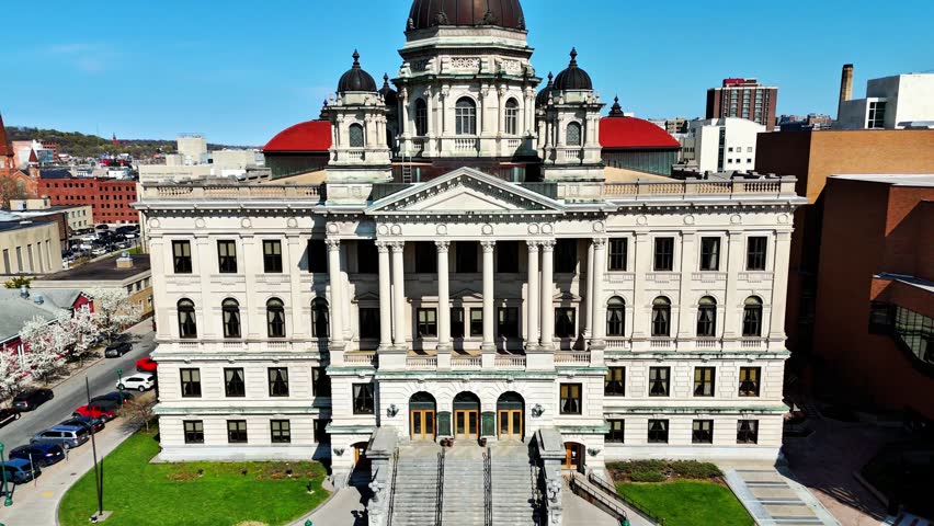 A building that houses the trials of the accused impartially and separating the fact from fiction to substantiate the credibility of a position and arrive at the truth. Syracuse, NY, USA - April 23, 2