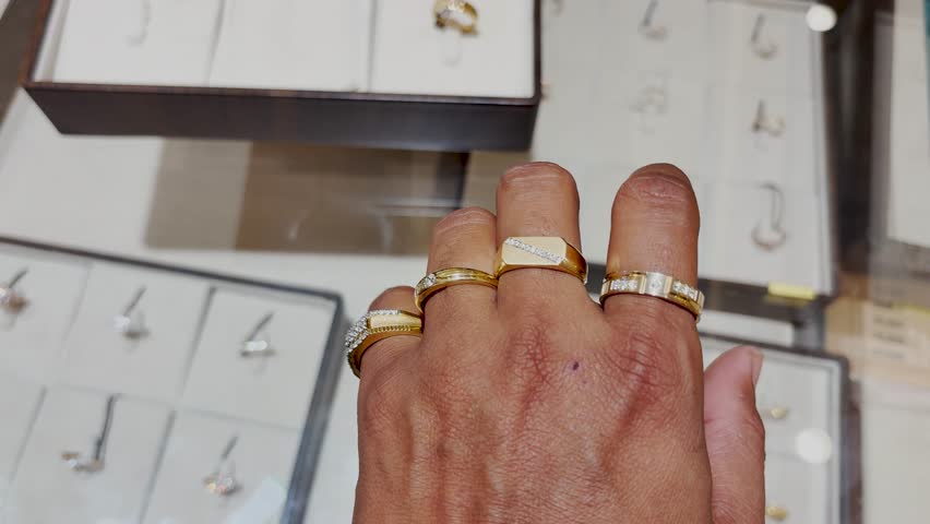 men’s gold and diamond band options for comparing at jewelry store