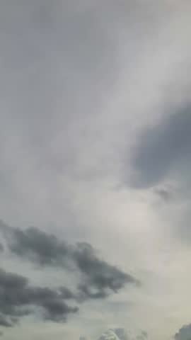 Gold ray of sundown slowly fall beyond the horizon, hot, grey cloudy, drizzle day, wet.