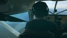 Pilot gripping yoke flying aviation craft above peaks drifting digital overlay indicating data. Aviation, adventure, exploration, cockpit, technology, altitude, scenic - Powered by Shutterstock - Get 15% off with code: PIKWIZARD15