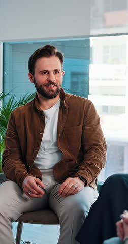 Man, sharing and talking in group therapy for mental health, personal growth and past trauma. Male person, discussion and counseling for addiction recovery, healing process and rehabilitation support