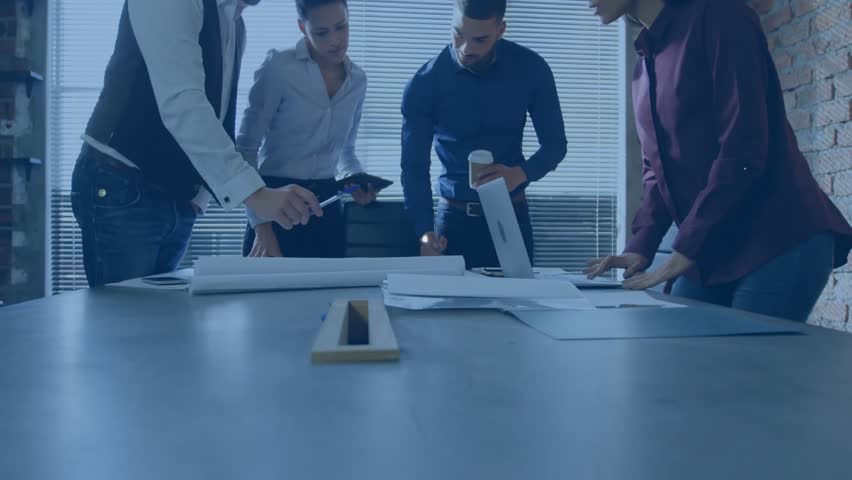 Business professionals collaborating around table reviewing docs with laptop network icons floating. Teamwork, innovation, digital connectivity, brainstorming, modern workspace, corporate strategy, - Powered by Shutterstock - Get 15% off with code: PIKWIZARD15