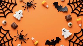 A halloween candy spider ghost bat web orange chocolate sweet spooky autumn decoration party festive horror treat trick eyeball gummy foam plastic toy seasonal holiday celebration background border - Powered by Shutterstock - Get 15% off with code: PIKWIZARD15