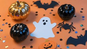 A halloween ghost pumpkin bat spider confetti orange black gold decoration playful ghost halloween decoration orange background with black and gold accents, pumpkins, bats, spider, confetti cheerful - Powered by Shutterstock - Get 15% off with code: PIKWIZARD15