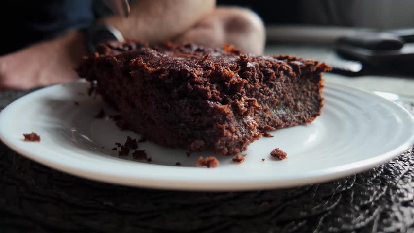 Homemade pumpkin brownie dessert eaten slowly showing texture and warmth
