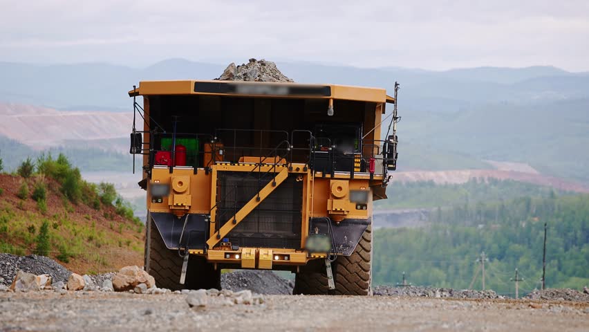 Open pit mine industry, Big yellow mining truck for coal working in quarry.