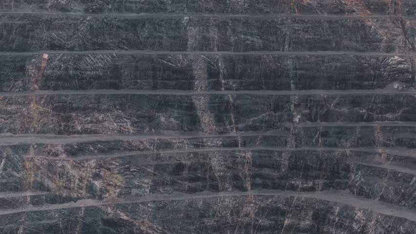 Aerial view Industry landscape of Open pit mine with geological structure of ore quarry with iron vein and copper, gold.