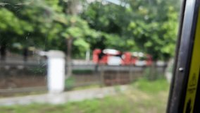 A view from a train window shows blurred trees and landscape passing by. The focus is on the motion and the scenery outside. - Powered by Shutterstock - Get 15% off with code: PIKWIZARD15
