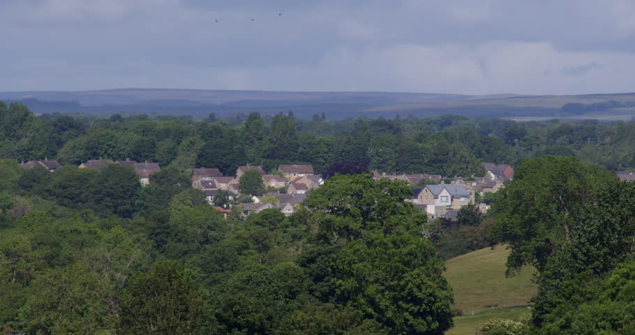 Long shot of the town of Barnard Castle with trees all round