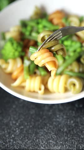 Pasta green vegetables Trottole green peas, green beans, kohlrabi cabbage, broccoli second course tasty snack fresh delicious gourmet food background on the table rustic food top view copy space