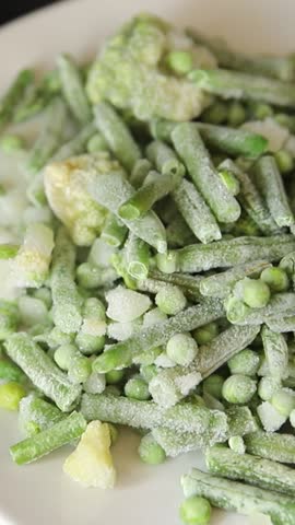 Green vegetables frozen food green peas, broccoli, string beans, kohlrabi kale tasty snack fresh food background on the table rustic food top view copy space keto and paleo diet vegan vegetarian 