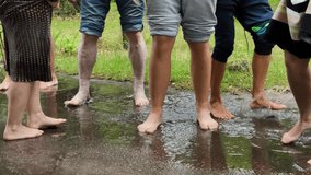 People barefoot jumping in a puddle in the rain - Powered by Shutterstock - Get 15% off with code: PIKWIZARD15