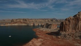 Aerial drone view showing red rock cliffs and deep blue lake near Horseshoe Bend in Page Arizona USA highlighting desert landscape, sandstone formations, and calm water surface. - Powered by Shutterstock - Get 15% off with code: PIKWIZARD15