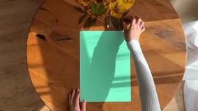 Woman creating autumn craft with maple leaves on paper, Seasonal DIY Art Project, video 4k with hands from above of fall-inspired decoration - Powered by Shutterstock - Get 15% off with code: PIKWIZARD15