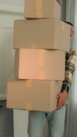 African American man with many boxes crash into couch sofa falling drop parcels ethnic male guy carry heavy goods buying stuff for new home flat disappointed worried internet shopping moving orders