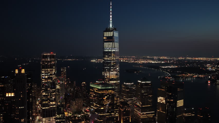 Aerial Night View of New York City's Skyscrapers and Iconic One World Trade Center at Late Night