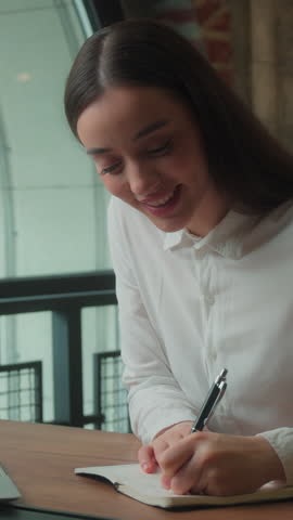 Caucasian business woman pensive thoughtful businesswoman come up with idea find answer writing note in notebook in office working specialist female student girl decide solution analyze corporate plan